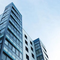 an image of a tall building with blue windows